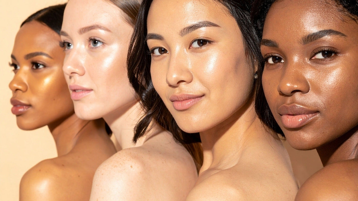 Portrait of four women with radiant skin to represent different skin types and tones