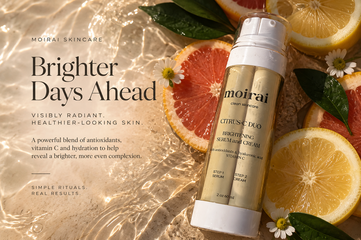 Moirai Skincare Citrus Suncado Brightening Serum Cream bottle displayed on a warm, textured beige background with citrus slices, green leaves, and white flowers.