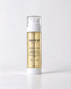 Moirai Citrus-C Duo Brightening Serum and Cream dual-chamber skincare bottle with vitamin C on a light gray background
