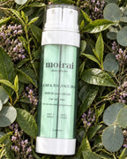 Moirai Clear & Balance Duo dual chamber serum and cream for oily, acne prone skin with niacinamide and green tea on botanical background 