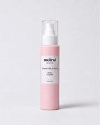 A bottle of Moirai Gentle Cleanser with Coconut Milk & Honey for sensitive skin, featuring a light pink bottle, white pump dispenser, and clear cap, set against a clean light gray background