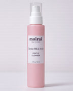Moirai Coconut Milk & Honey Gentle Cleanser pink bottle on light background