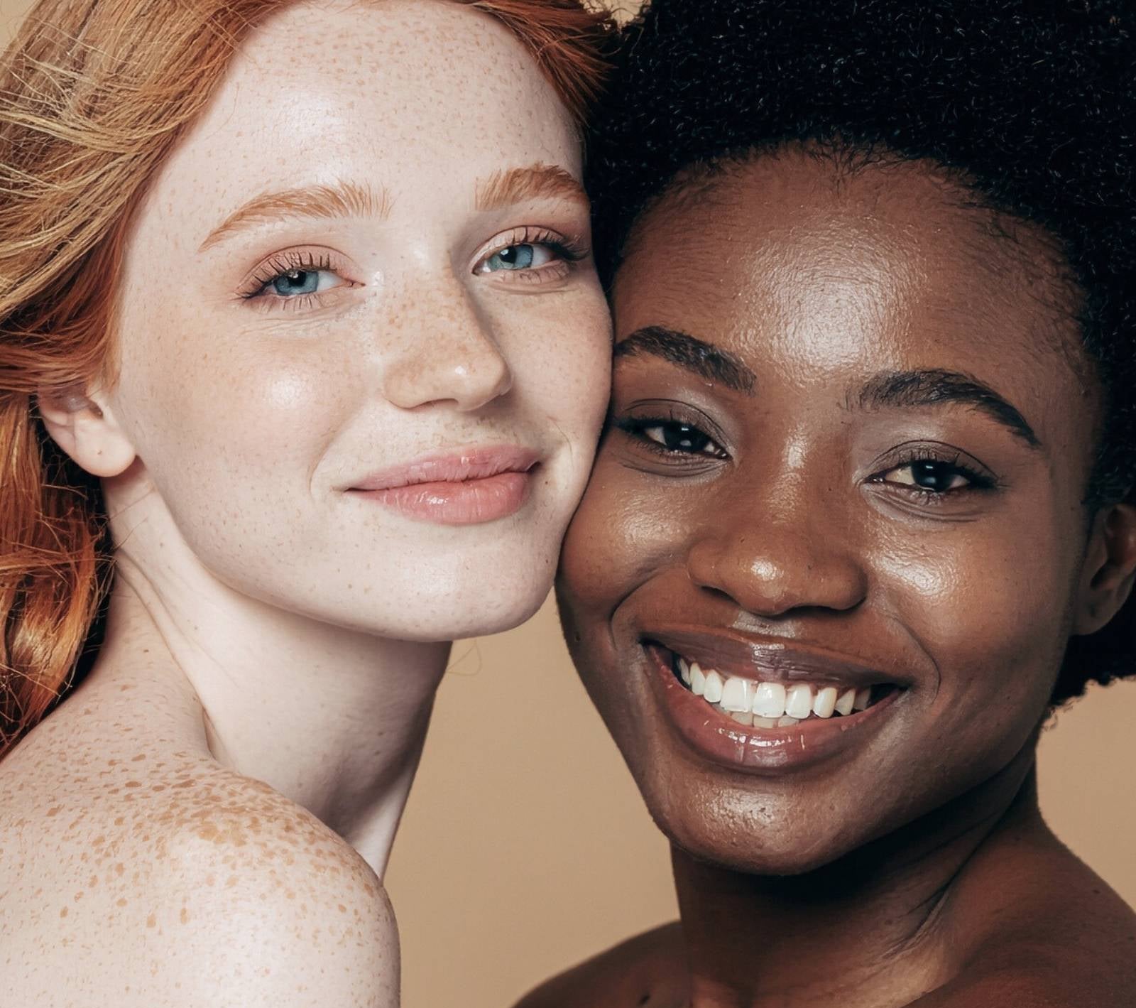 Two women with different skin tones and healthy glowing skin representing Moirai dual-delivery skincare