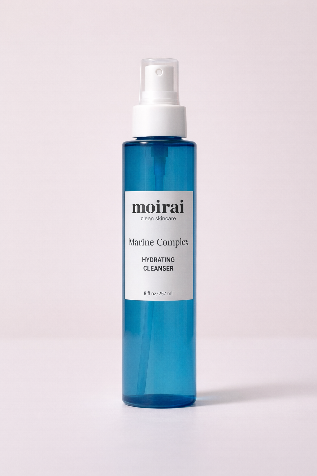 Blue bottle of Moir Marine Complex Hydrating Cleanser on off white background