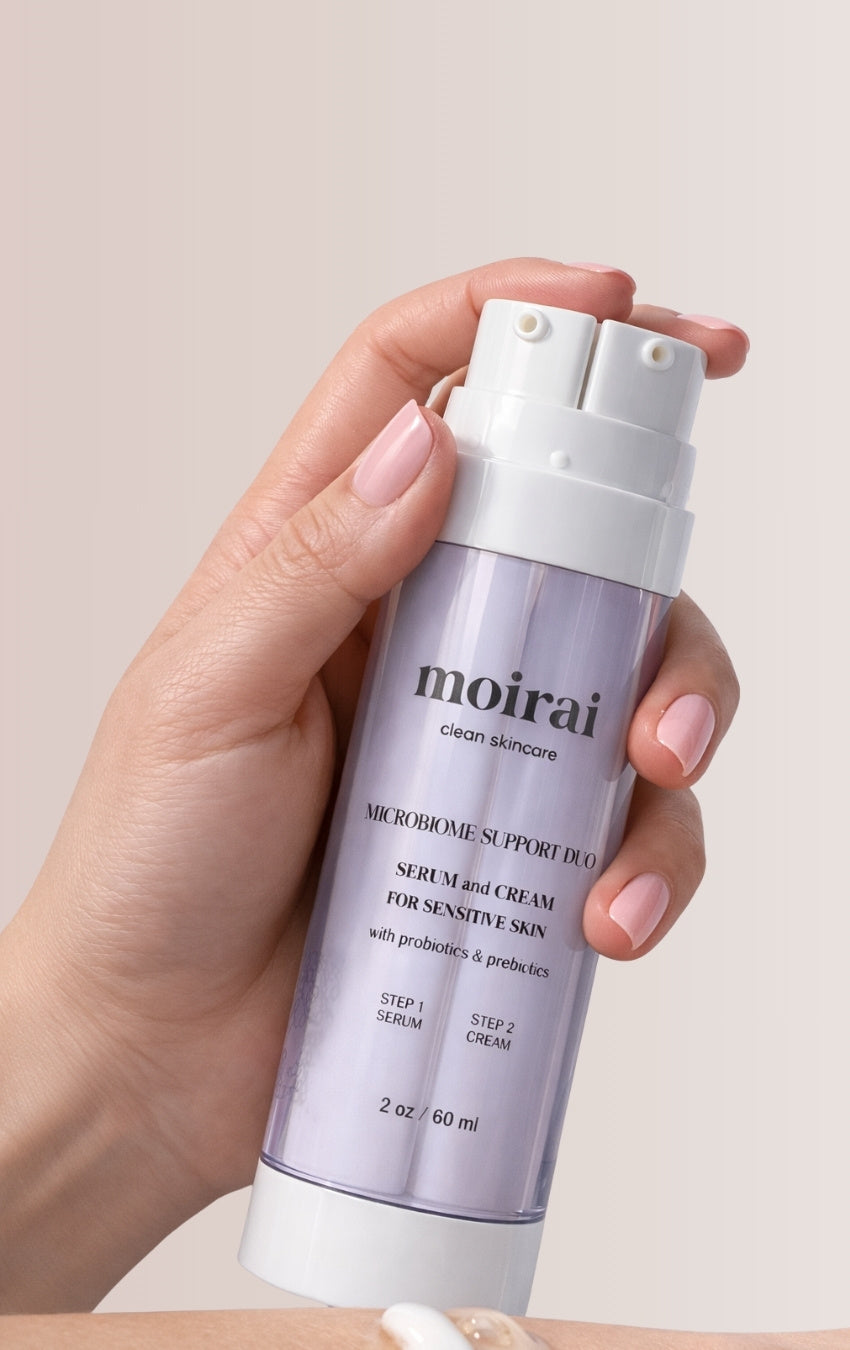 Moirai Microbiome Support Duo dual-delivery probiotic serum and cream held in hand