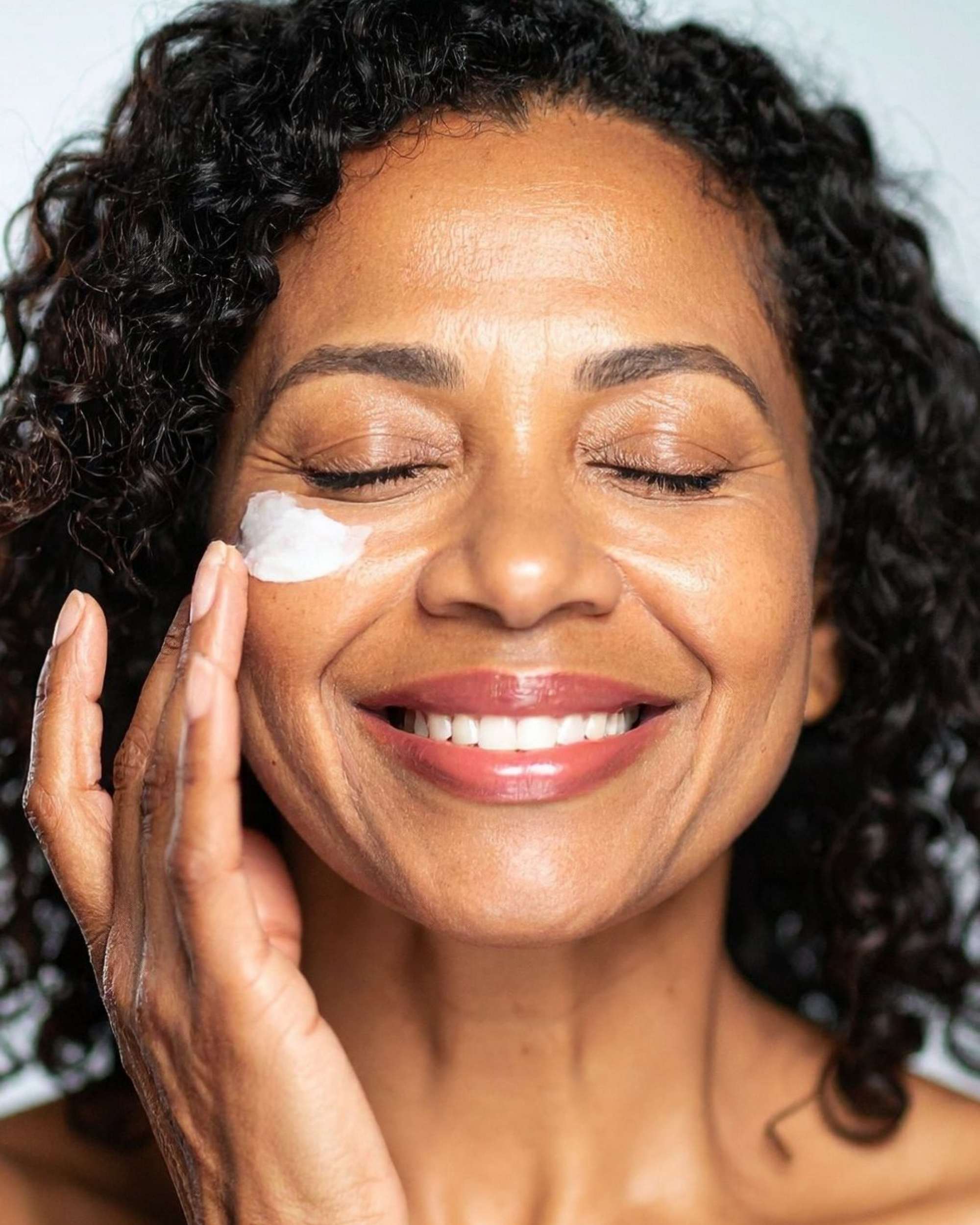 Woman with smooth, radiant skin representing the firming and rejuvenating benefits of Moirai Peptide Firming Duo.