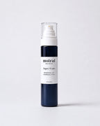 Moirai Super Fruits Refreshing and Nourishing Toner in a deep navy-blue bottle with white pump on a soft blush background