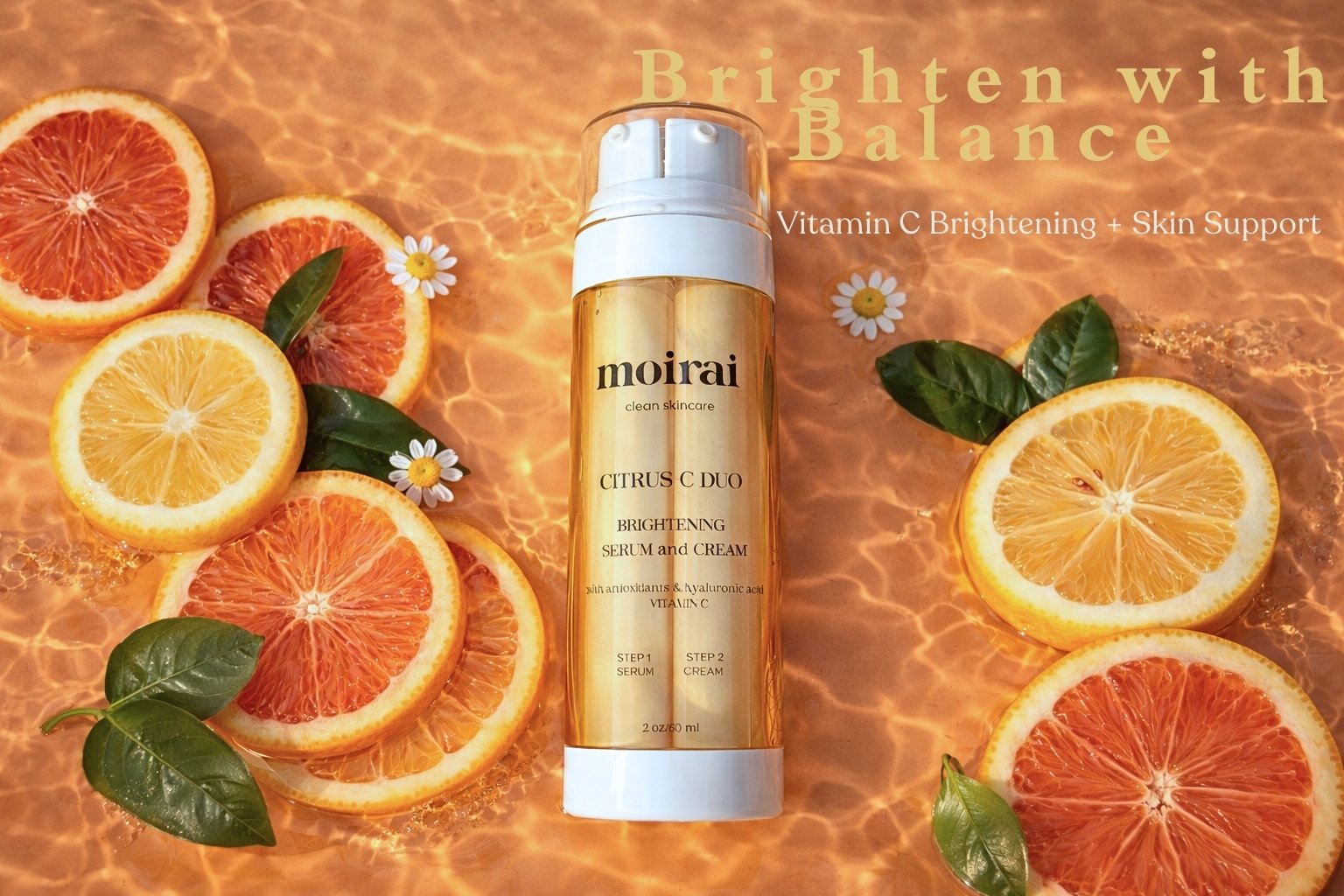 Moirai Citrus C Duo dual-delivery vitamin C serum and cream surrounded by citrus fruit for brightening and balanced skincare.
