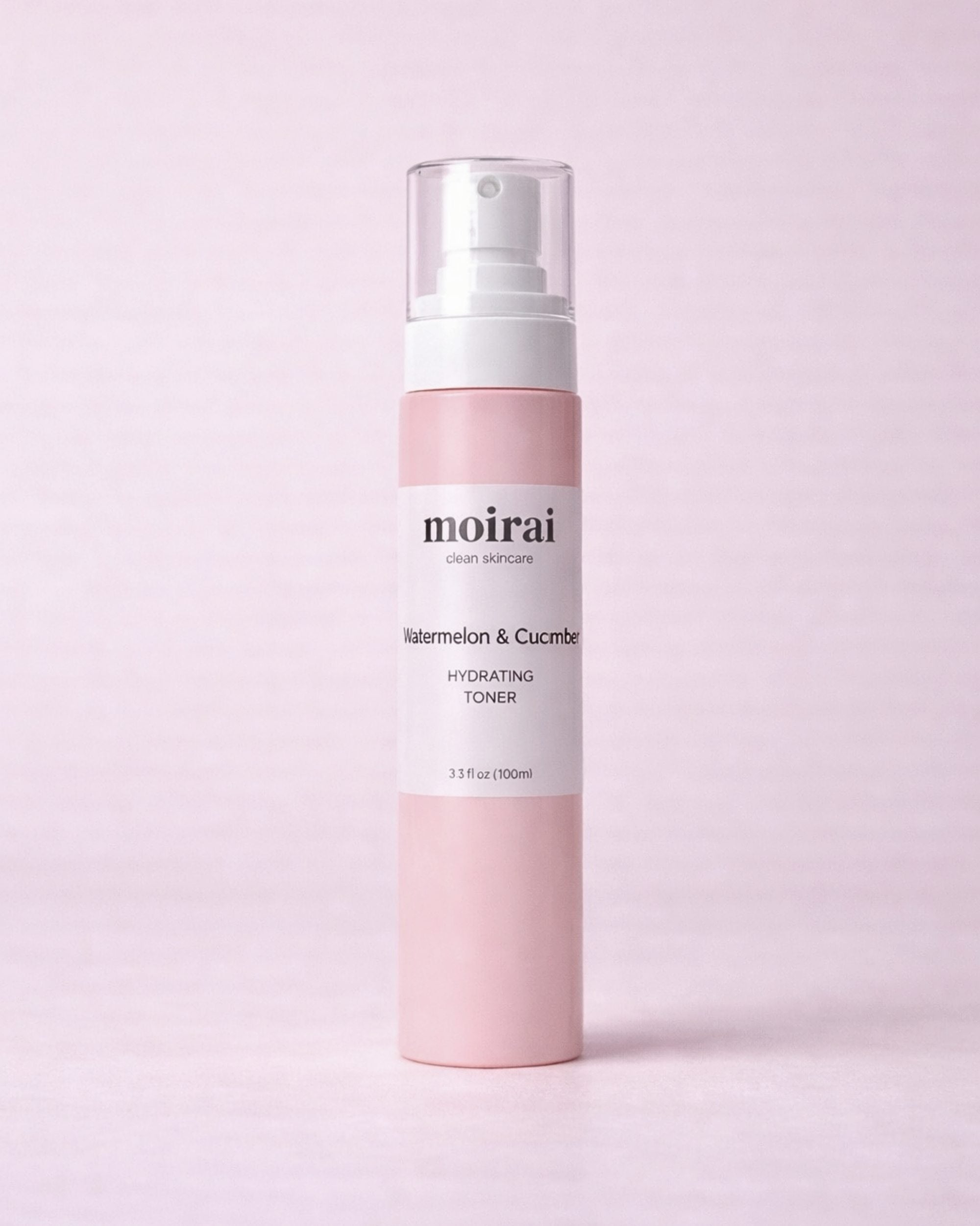 Moirai Watermelon & Cucumber Hydrating Toner in a soft pink bottle with white mist cap on a blush background.