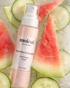 Watermelon and cucumber hydrating toner by Moirai Skincare surrounded by fresh fruit slices on icy background
